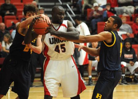 Sophomore center Roland Banhoro (45) grabs a rebound in Union's win over Blue Mountain (Miss.) College. - Photo by Morris Abernathy