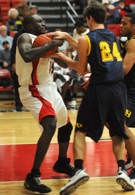 Sophomore Roland Banhoro (45) fights for a rebound in Union's win over Blue Mountain (Miss.) College. - Photo by Morris Abernathy