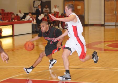 Alan North plays defense in the Bulldog's semifinal round win in the TranSouth Conference Tournament. - Photo by Morris Abernathy