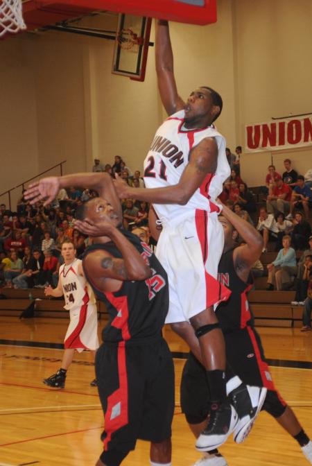 Brian Lake (21), senior forward, shoots over a defender in Union's win over Martin Methodist (Tenn.) College in the conference tournament. - Photo by Morris Abernathy
