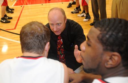 Union Head Coach Ralph Turner (center) instructs senior guard Matt Neaville (left) before tip off. - Photo by Morris Abernathy