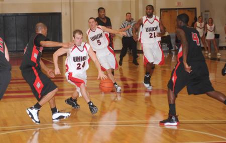 Matt Neaville (24) brings the ball down the floor in Union's TranSouth Tournament semifinal game versus Martin Methodist (Tenn.) College. - Photo by Morris Abernathy