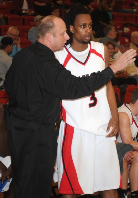 Tacuma Alexander listens to instruction from Head Coach Ralph Turner. - Photo by Morris Abernathy