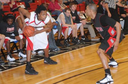 Tacuma Alexander prepares to drive around a defender in Union's win over Martin Methodist (Tenn.) College in the semifinal round of the TranSouth Conference Tournament. - Photo by Morris Abernathy
