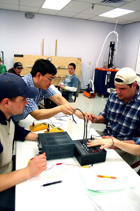 Don Van, engineering chair, supervises an experiment in the engineering lab. - Photo by Kristi McMurry Woody