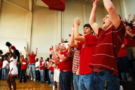 Fans cheer for Union at the TranSouth Conference Tournament Finals against Freed-Hardeman. Students were instructed to wear red for a 'red out.' - Photo by Kristi McMurry Woody