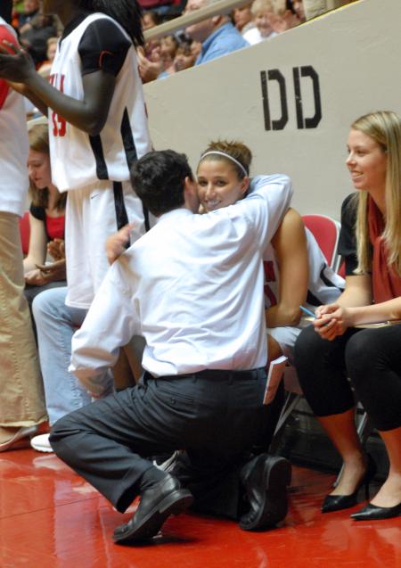 Coach Mark Campbell gives graduating senior Merideth Richardson Jacobs a hug after the Lady Bulldogs win the 2009 NAIA championship title. - Photo by Kristi McMurry Woody