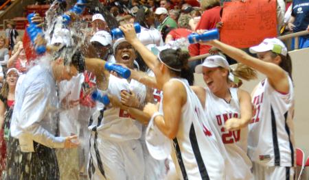 The Lady Bulldogs douse Coach Mark Campbell with water after winning the 2009 NAIA championship against Lambuth University. - Photo by Kristi McMurry Woody