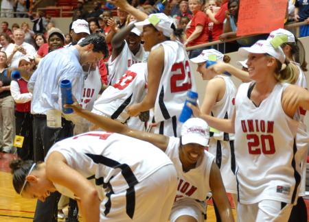 The Lady Bulldogs douse Coach Mark Campbell with water after winning the 2009 NAIA championship against Lambuth University. - Photo by Kristi McMurry Woody