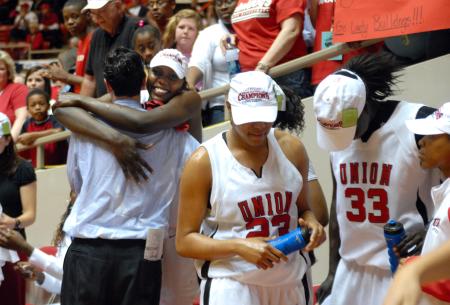 Graduating senior, Josephine Owino, shares a hug with coach Mark Campbell after the Lady Bulldogs win the 2009 NAIA championship against Lambuth University. - Photo by Kristi McMurry Woody