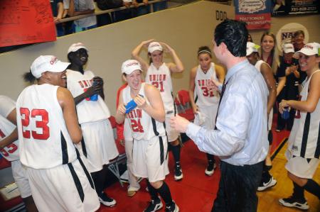 Coach Campbell celebrates with the Lady Bulldogs after the NAIA national championship win. - Photo by Morris Abernathy