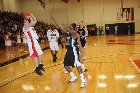 Matt Neaville shoots over a defender in Union's win win over Freed-Hardeman (Tenn.) University in the TranSouth Conference championship game. - Photo by Morris Abernathy