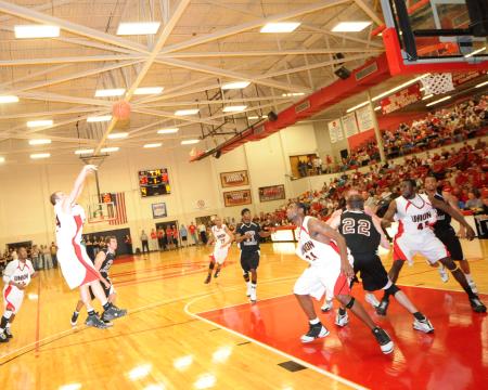 Union's Matt Neaville (24) makes a shot in the Bulldog's 105-78 win over Freed-Hardeman (Tenn.) University in the TranSouth Conference Tournament title game. - Photo by Morris Abernathy