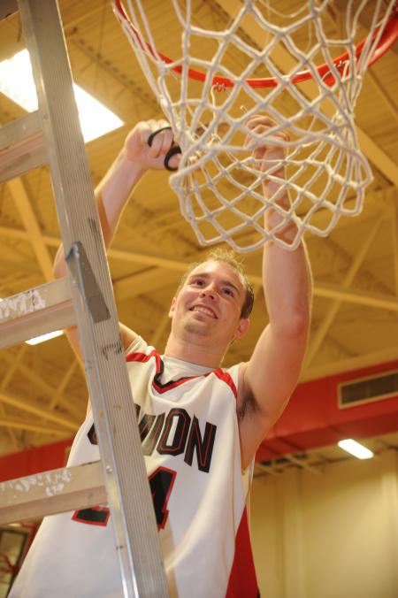 Union senior Matt Neaville cuts down a piece of the net after helping the Bulldogs win the 2009 TranSouth Conference Tournament championship. - Photo by Morris Abernathy