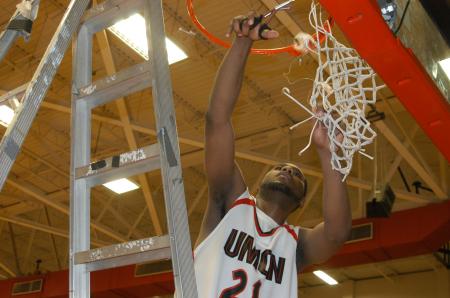 Union senior Brian Lake cuts down the net after helping the Bulldogs win the 2009 TranSouth Conference Tournament championship. - Photo by Morris Abernathy
