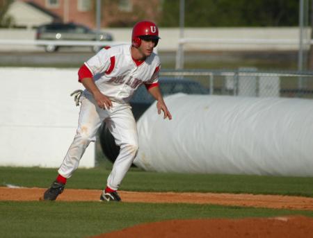 Third baseman David Maristany takes a lead off first base in Union's win over Crichton (Tenn.) College. - Photo by Steven Aldridge