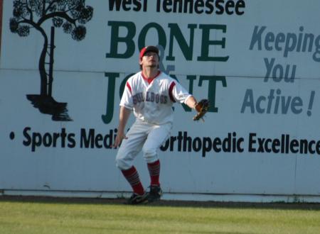 Clint Barnes backs up to the wall to catch a fly ball. - Photo by Steven Aldridge