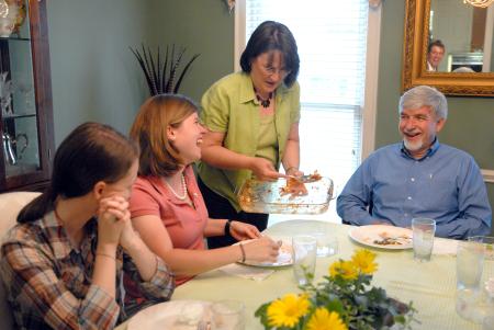 Alice Nettles, wife of Dr. Bill Nettles, serves the last bit of lasagna to her guest, Rebecca Eaton, sophomore mathematics major, at Be Our Guest. - Photo by Kristi McMurry Woody