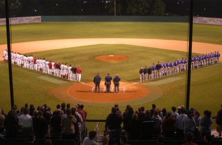 Fans and players stand at attention during the National Anthem before the Union's first game of the 2009 TranSouth Conference Tournament versus Trevecca Nazarene (Tenn.) University. - Photo by Steven Aldridge