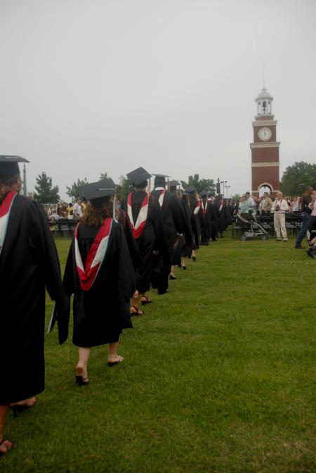 Graduates file onto the Great Lawn for spring graduation. - Photo by Angela Abbamonte