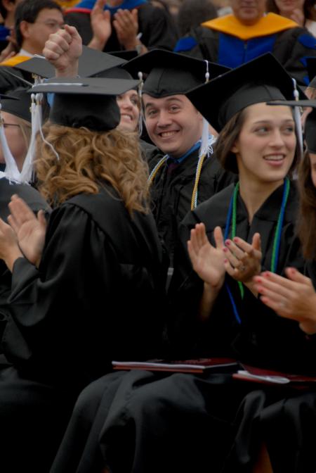 Jonathan Lambach celebrates at spring graduation after receiving his bachelor of arts in Theatre. - Photo by Angela Abbamonte