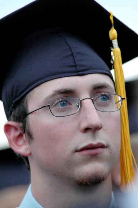 Digital media studies graduate Casey Yates listens as President Dockery gives closing remarks during spring graduation on Saturday, May 23, 2009. - Photo by Beth Spain
