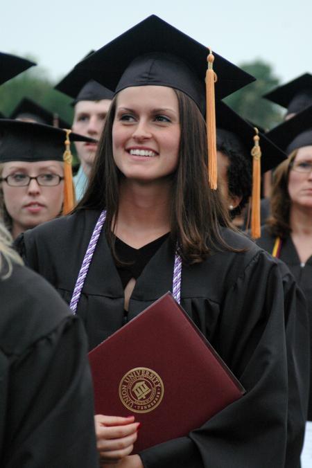 Michelle Albonetti stands for the recessional during spring graduation. - Photo by Beth Spain