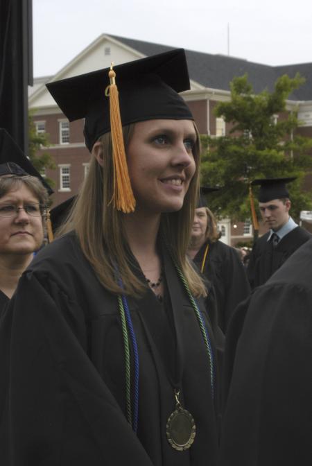 Heather Martin waits expectantly to receive her diploma during spring graduation. - Photo by Morris Abernathy