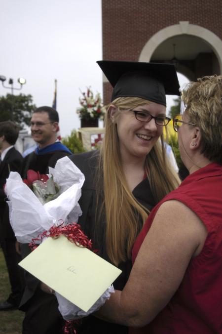 Debra Howell is congratulated by her mother Judy after the spring graduation ceremony. - Photo by Sarah Palmer Goff