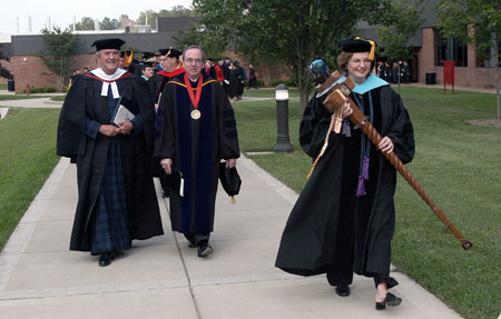 U. S. Senate Chaplain Lloyd John Ogilvie accompanies President David S. Dockery and Faculty of the Year Ann Singleton out to the Great Lawn for Spring Graduation 2003. - Photo by Jim Veneman
