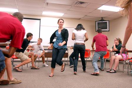 Lily Coursey plays an icebreaker game with her Focus group during new student orientation. - Photo by Kristi McMurry Woody