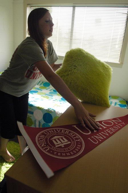 Stephanie Morris, Pre-Pharmacy freshman from Oak Ridge, Tenn., settles into her room in the Heritage Complex. - Photo by Sarah Palmer Goff