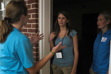 Jill Brown, senior French major, speaks with Sara Byars, freshman nursing major from Dyersburg, Tenn., and her mother LaDon about life at Union. - Photo by Sarah Palmer Goff