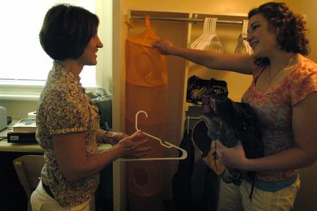 Hilary Howse, freshman nursing major from Elk River, Minn., discusses where to store items in her room with her mother, Mary Ellen. - Photo by Sarah Palmer Goff