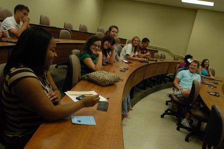 Teriquita Manns has fun with her Focus group as they play a game involving sharing random facts about their lives during new student orientation. - Photo by Sarah Palmer Goff