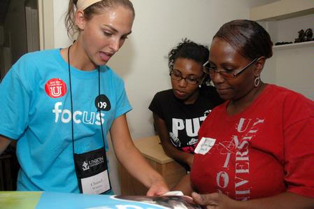 Senior Business major Chanel Watson meets one of her Focus students, Apree Jackson, and her mother Lavonda Capbell, from Memphis, Tenn., during move-in day in the Heritage Complex. - Photo by Beth Spain