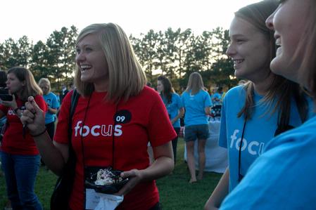 Sophomore Andi Shreiber enjoys ice cream and friends during an ice cream social at President Dockery's house during new student orientation. - Photo by Beth Spain