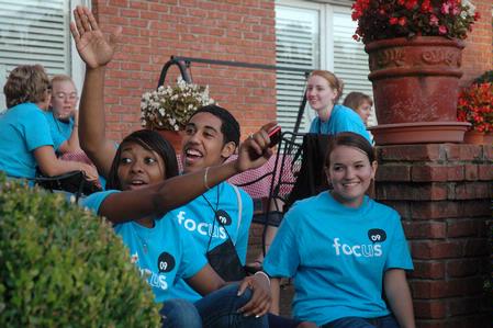 Freshmen Melanie Taylor, Matt Arnold and Mary Lynn Bruner mingle with friends at President Dockery's Ice Cream social during new student orientation. - Photo by Beth Spain