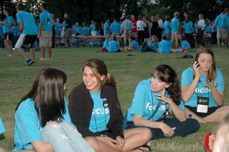 Students enjoy ice cream and new friends during an ice cream social at President Dockery's house during new student orientation. - Photo by Beth Spain