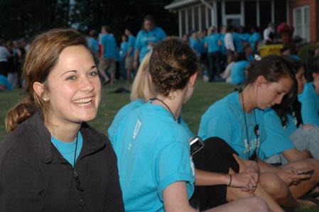 Freshman Kelly Gildernew talks with friends during an ice cream social at President Dockery's house during new student orientation. - Photo by Beth Spain