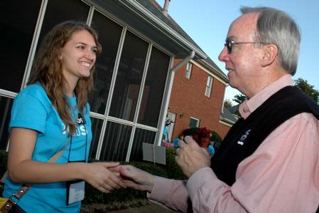 President Dockery greets Freshman Elyssa Cross during an ice cream social at his home during new student orientation. - Photo by Beth Spain