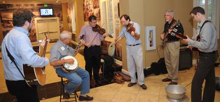 A Union faculty band including Taylor Worley, Gavin Richardson, Hal Poe, Bill Nettles, and Greg Thornbury (along with George Brint) play some opening music for the Faculty/Staff Dinner. - Photo by Morris Abernathy