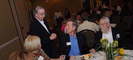 President Dockery visits with Tom Rosebrough and Ralph Leverett before the Faculty/Staff Dinner. - Photo by Morris Abernathy