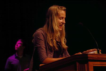 Emily Logan reads scripture during the new student worship service during orientation. - Photo by Beth Spain