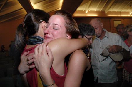 Molly Bricker hugs her sister Grace goodbye after the new student worship service during orientation. - Photo by Beth Spain