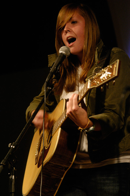 Freshman Kelsey Meadows performs an original song for the Focus Open Mic during new student orientation. - Photo by Sarah Palmer Goff