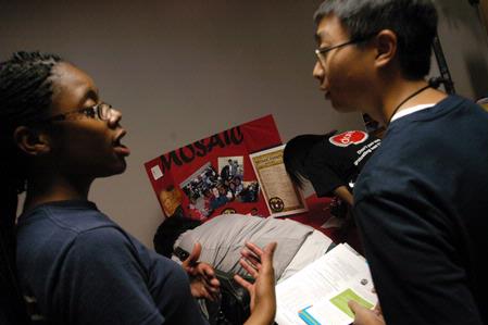 Mandisa Wofford, junior English/Economy major, speaks with Michael Lam, freshman Pre-Med major, about joining MOSAIC. - Photo by Sarah Palmer Goff