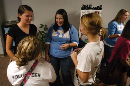 Ebbie Davis, sophomore media communications major, speaks with Freshmen Bethany Crann, and Brittany Bural about joining Zeta Tau Alpha. - Photo by Sarah Palmer Goff