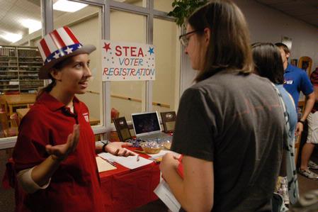Hannah Marsh, sophomore education major, speaks with Freshman Betsy Olsen about STEA Voter Registration at the organization fair. - Photo by Sarah Palmer Goff