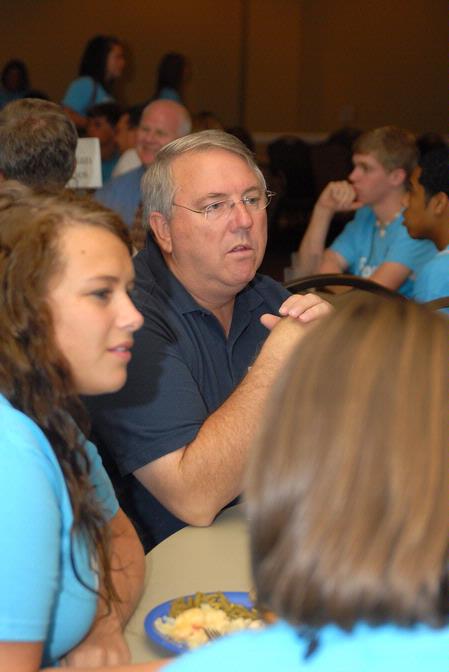 Michael Chute, professor of communication arts, talks with incoming freshmen who are interested in the communication arts department during new student orientation. - Photo by Kristi McMurry Woody